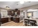 Open kitchen with breakfast bar and view into game room at 4311 E Roma Ave, Phoenix, AZ 85018