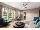 Bright and airy living room with comfortable seating and large windows at 4311 E Roma Ave, Phoenix, AZ 85018