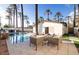 Inviting pool area with lounge chairs and a built-in grill at 4311 E Roma Ave, Phoenix, AZ 85018