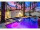 Stunning pool and patio area at dusk with colorful sunset at 4311 E Roma Ave, Phoenix, AZ 85018