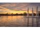 Scenic community lake with fountains at sunset at 43594 W Bravo Ct, Maricopa, AZ 85138