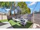 Backyard with artificial turf and shade sail at 4832 W Caron St, Glendale, AZ 85302