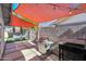 Backyard patio with shade sails, grill, and seating area at 4832 W Caron St, Glendale, AZ 85302