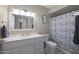 Clean bathroom with a shower/tub combo and white vanity at 4832 W Caron St, Glendale, AZ 85302