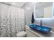 Modern bathroom with blue glass sink and updated vanity at 4832 W Caron St, Glendale, AZ 85302