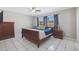 Primary bedroom with a sleigh bed and dresser at 4832 W Caron St, Glendale, AZ 85302