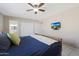 Primary bedroom with a sleigh bed and en-suite bathroom at 4832 W Caron St, Glendale, AZ 85302
