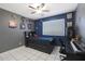 Bright bedroom with a twin bed, desk, and sports themed decor at 4832 W Caron St, Glendale, AZ 85302