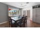 Bright dining area with glass top table and view to backyard at 4832 W Caron St, Glendale, AZ 85302