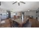 Open concept dining area with glass table and seating for six at 4832 W Caron St, Glendale, AZ 85302