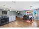 Open concept kitchen with island, stainless steel appliances, and ample counter space at 4832 W Caron St, Glendale, AZ 85302