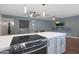 Modern kitchen with stainless steel appliances and a sleek white countertop at 4832 W Caron St, Glendale, AZ 85302