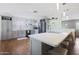 Modern kitchen with stainless steel appliances and an island at 4832 W Caron St, Glendale, AZ 85302