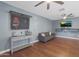 Living room with gray couch and media shelving at 4832 W Caron St, Glendale, AZ 85302