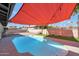 Relaxing pool area featuring a shade sail at 4832 W Caron St, Glendale, AZ 85302