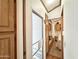 Bright hallway with wood floors and access to bedrooms at 523 S Jaspar Dr, Apache Junction, AZ 85119
