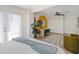 Bright bedroom with a queen bed, built-in desk, and stylish decor at 7732 E 4Th St, Scottsdale, AZ 85251