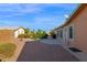 Spacious backyard with gravel landscaping, a patio, and a view of neighboring homes at 8500 E Southern Ave # 548, Mesa, AZ 85209