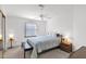 Spacious bedroom with ceiling fan, window coverings, and wooden furniture at 8500 E Southern Ave # 548, Mesa, AZ 85209
