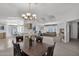 Open dining room with views into the living room and kitchen at 8500 E Southern Ave # 548, Mesa, AZ 85209