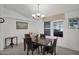 Bright dining area with a four-person table and chandelier at 8500 E Southern Ave # 548, Mesa, AZ 85209