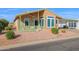 Charming manufactured home with covered porch and neatly landscaped yard at 8500 E Southern Ave # 548, Mesa, AZ 85209