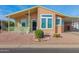 Attractive single-story home with a covered porch and well-maintained landscaping at 8500 E Southern Ave # 548, Mesa, AZ 85209