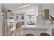 Bright kitchen with ample cabinetry, a gas range, and a breakfast nook at 8500 E Southern Ave # 548, Mesa, AZ 85209