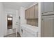 Functional laundry room with washer, dryer, cabinets, and access to exterior at 8500 E Southern Ave # 548, Mesa, AZ 85209
