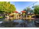 Landscaped backyard with patio furniture and string lights at 11957 N 140Th Ln, Surprise, AZ 85379