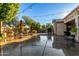 Outdoor patio area with string lights and multiple seating areas at 11957 N 140Th Ln, Surprise, AZ 85379