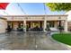Spacious backyard patio with covered seating area, string lights, and artificial turf at 11957 N 140Th Ln, Surprise, AZ 85379
