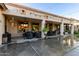 Covered patio with seating area, string lights, and ceiling fans at 11957 N 140Th Ln, Surprise, AZ 85379
