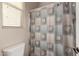 Clean bathroom with double vanity, shower, and neutral decor at 11957 N 140Th Ln, Surprise, AZ 85379