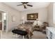 Charming bedroom with a sitting area and ensuite bathroom at 11957 N 140Th Ln, Surprise, AZ 85379