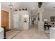 Bright entry hall with built-in shelving and coat closet at 11957 N 140Th Ln, Surprise, AZ 85379