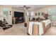 Gathering room with fireplace and built-in entertainment center at 11957 N 140Th Ln, Surprise, AZ 85379