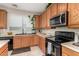 Kitchen corner with sink and stainless steel stove at 11957 N 140Th Ln, Surprise, AZ 85379
