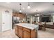Kitchen with curved island and stainless steel appliances at 11957 N 140Th Ln, Surprise, AZ 85379