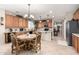 Open kitchen with island and breakfast nook at 11957 N 140Th Ln, Surprise, AZ 85379