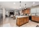 Open kitchen with island and stainless steel appliances at 11957 N 140Th Ln, Surprise, AZ 85379