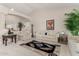 Comfortable living room with neutral color palette and area rug at 11957 N 140Th Ln, Surprise, AZ 85379