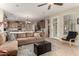 Spacious living room with L-shaped sofa and kitchen view at 11957 N 140Th Ln, Surprise, AZ 85379