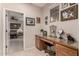 Home office with a large desk, window, and ample storage at 11957 N 140Th Ln, Surprise, AZ 85379