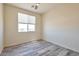 Spacious bedroom with window and wood-look floors at 1278 W Calle Tuberia --, Casa Grande, AZ 85194