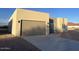 Modern stucco home with a two-car garage and desert landscaping at 1278 W Calle Tuberia --, Casa Grande, AZ 85194