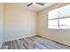 Well-lit bedroom featuring a window and ceiling fan at 1298 W Calle Tuberia --, Casa Grande, AZ 85194