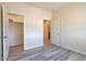 Bedroom with two closets and wood-look flooring at 1298 W Calle Tuberia --, Casa Grande, AZ 85194