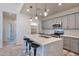 Contemporary kitchen featuring gray cabinets, quartz countertops, and pendant lighting at 1298 W Calle Tuberia --, Casa Grande, AZ 85194