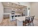 Modern kitchen with gray cabinets, quartz countertops, and an island at 1298 W Calle Tuberia --, Casa Grande, AZ 85194